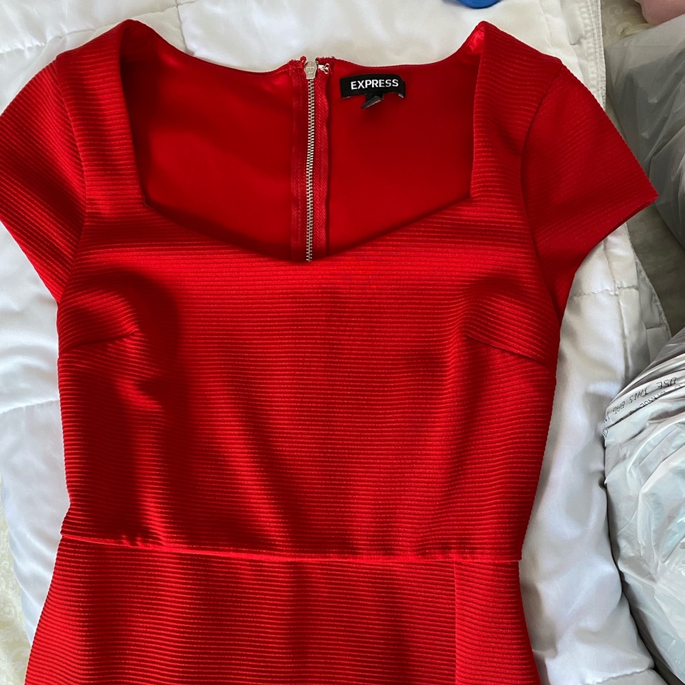 Express red dress in a size XS. Goes down to the knee but has a sexy slit. - Picture 2 of 6